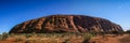 Panoramic view on Uluru Uluru, or Ayers Rock, a massive sandstone monolith in the heart of the Northern Territory, Australia Royalty Free Stock Photo